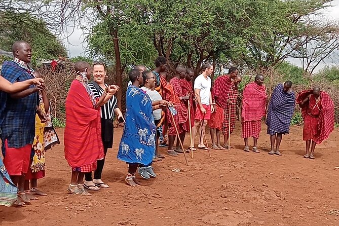 Masai Village half day Tour from Nairobi - Milking cows: seeing work that keeps the day moving